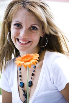 beautiful young blonde woman with flower