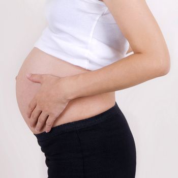 8 months pregnant Asian woman.