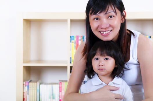 Happy young Asian mother and daughter.