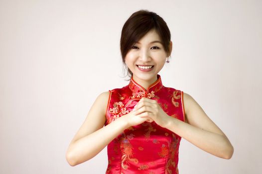 Oriental girl wishing you a happy chinese new year 