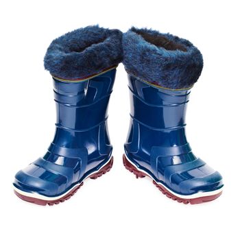 A pair of small rubber boots with artificial fur isolated on white background