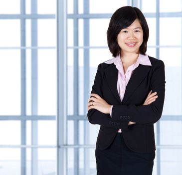 Asian business women standing in office.