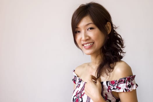 Portrait of young Asian girl with her smiling face.