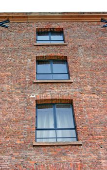Three Windows in an Old Converted Warehouse