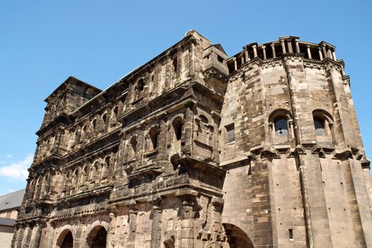 The Porta Nigra is a 2nd-century Roman city gate in Trier, Germany. It was given its name (which means "black gate") in the Middle Ages because of its weathered color. The Porta Nigra is the only one of four Roman gates that still stands in Trier, the eldest city in Germany.