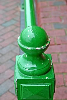 Green Knob at the end of some railings
