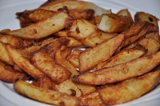 Real British Chips on a White Plate in an English Farmhouse