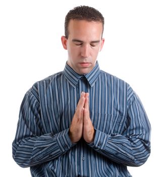 A young man wearing a blue striped shirt is giving a quick prayer for something, isolated against a white background