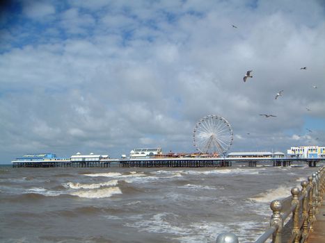 Blackpool Pier and Stormy Sea with Seagulls