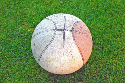 Dirty Basketball on Grass