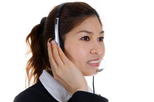 Friendly Customer Representative with headset smiling during a telephone conversation.