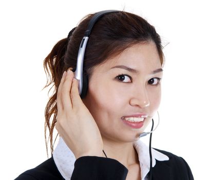 Friendly Customer Representative with headset smiling during a telephone conversation.