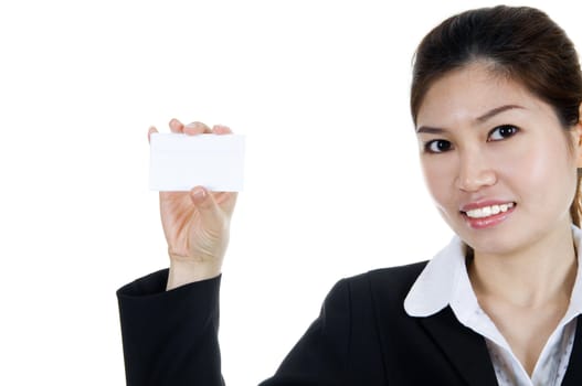 Young Asian with blank business card in a hand.