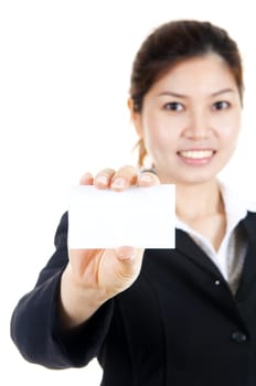 Young Asian with blank business card in a hand.