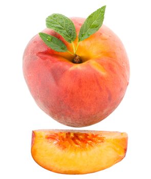 close-up ripe peach with leaves, isolated on white