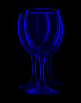 three empty wine glasses, isolated on black