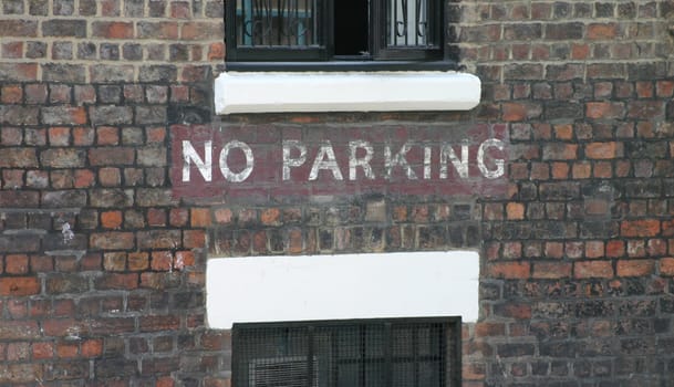 No Parking Sign on Old Building