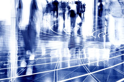 A shopping mall. Long exposure for intentional motion blur of people.