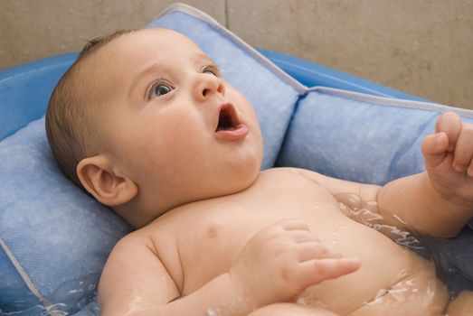 Cute baby taking a bath