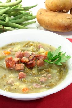 Bean soup with roasted bacon and lovage