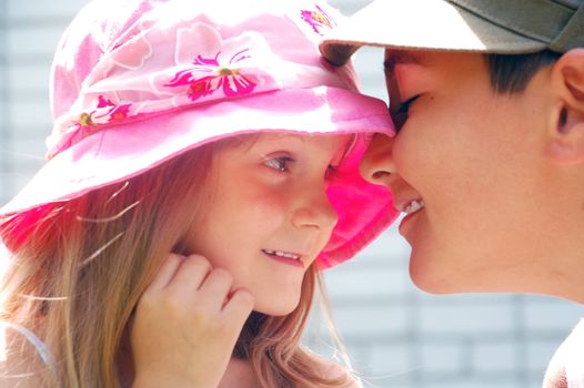 portrait of two kids looking at each other with tender expression