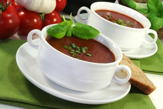 Tomato soup with basil and fresh vegetables
