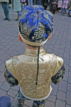 Boy in Chinese Outfit Waiting for New Year Celebrations, Liverpool, Merseyside, UK