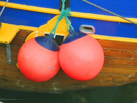 Buoys on the side of an old ship