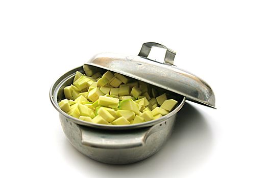 Green fresh vegetable marrows on a white background.