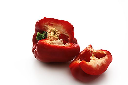 One red sweet pepper on a white background.