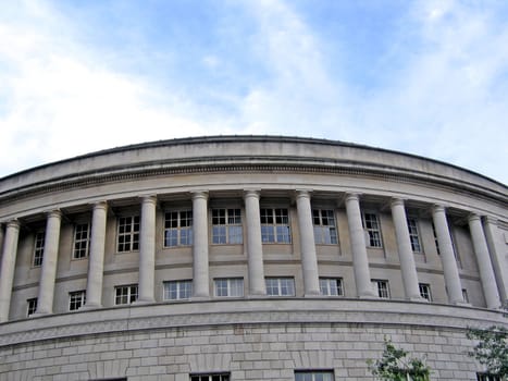 Massive Circular Building with Tall Columns