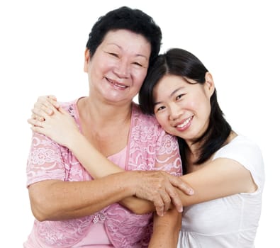 Happy Asian family. Daughter hugging her mother.