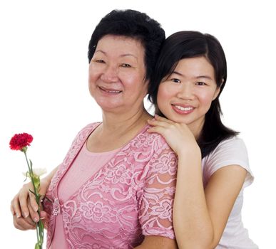 Happy Asian Mother and Daughter with carnation flower