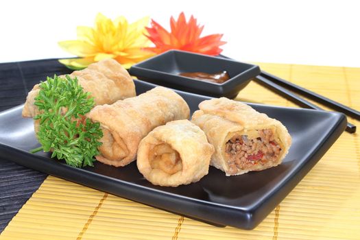 a spring roll stuffed with minced meat and tomatoes