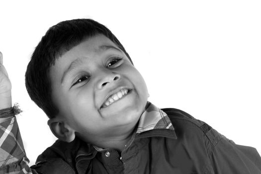 A portrait of a cute Indian kid in a happy mood.