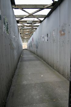 Disgusting Public Pathway Lined in Iron Sheeting