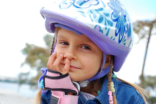 cute 5 years old smiling child wearing a protective helmet