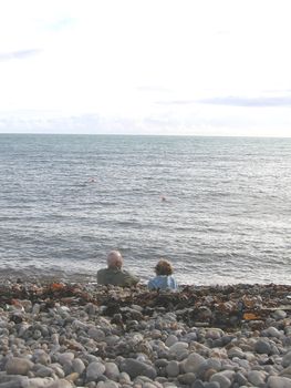 Old Couple on a South Devon Beach in Winter