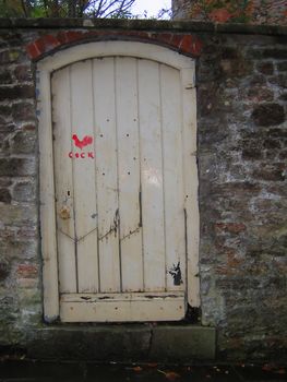 White Door with Red Cock on it