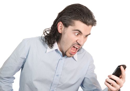 Young dark haired caucasian man in light blue striped shirt screaming angrily at his mobile phone isolated on white