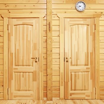 Closed wooden doors to  the rooms in house