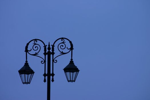 Sihouette of Old Street Light Against Blue Sky
