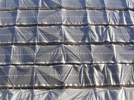 Building Covered in Tarpaulines for Renovation