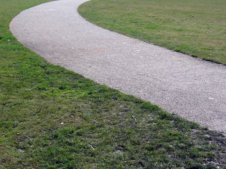 Curved Stone Chip Path on Grass Lawn in Park