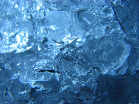 A background of blue shining crystals of ice.