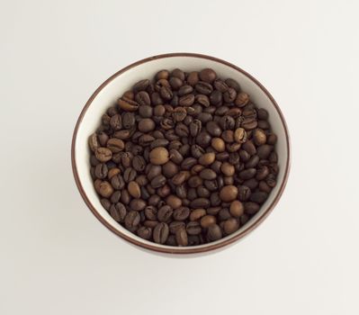 A cup full of coffee beans