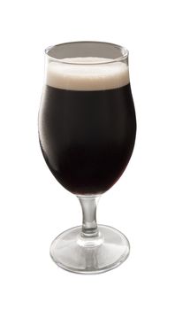 Close up of a glass of irish stout over white background