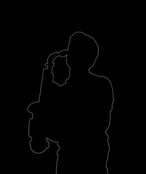Silhouette of a sax player over black background

