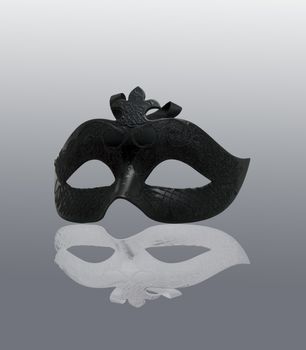 Black Mask with white reflection, over gray background