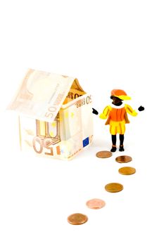 House made of money with money street and zwarte piet (dutch) on white